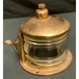An unusual early 20th century brass teardrop shaped bulkhead lamp, S L & Co, 20cm high