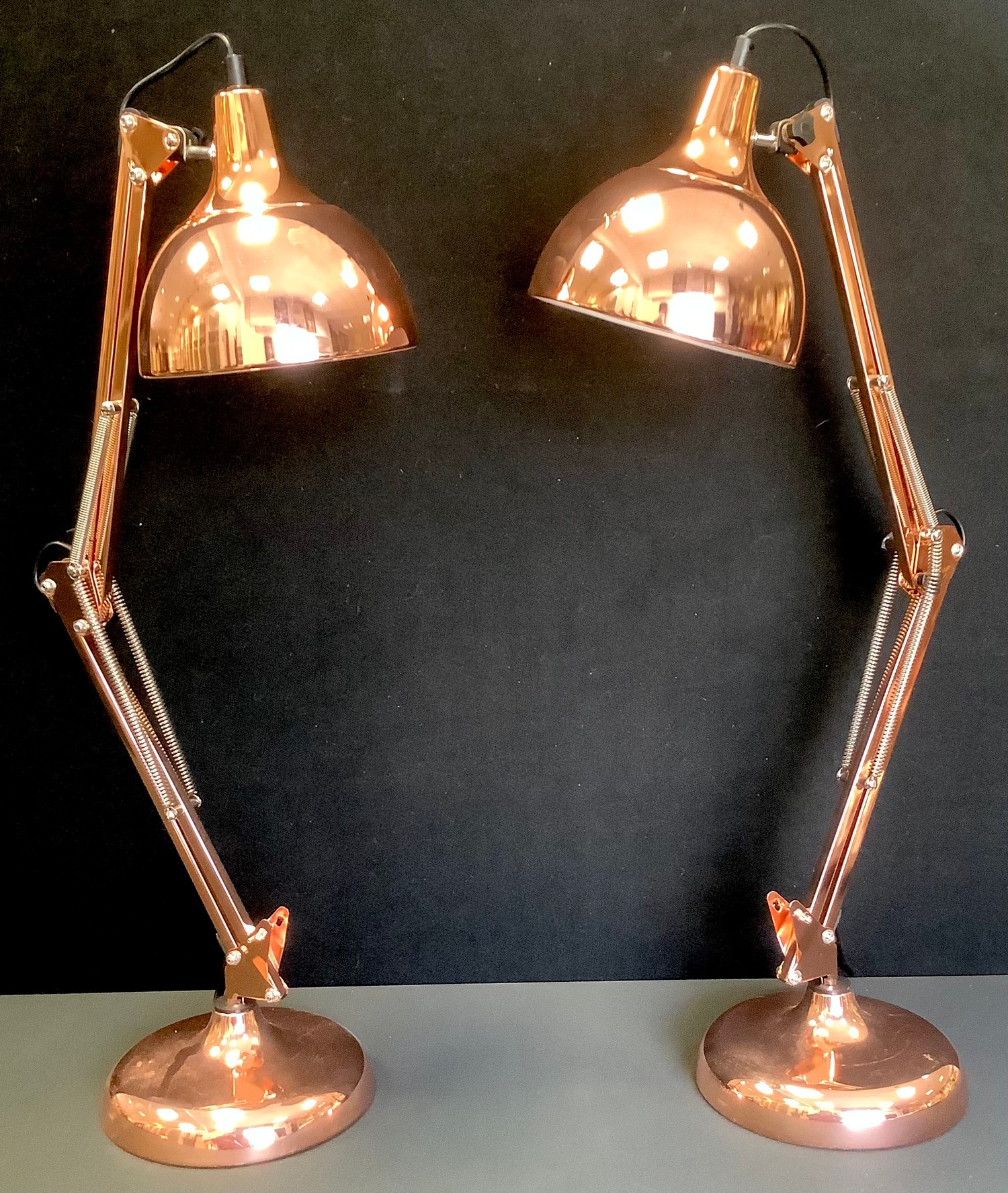 A pair of contemporary gilt metal angle poise type side lights