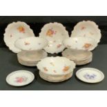 An early 20th century Continental dessert service, decorated with summer flower sprays, c.1910;