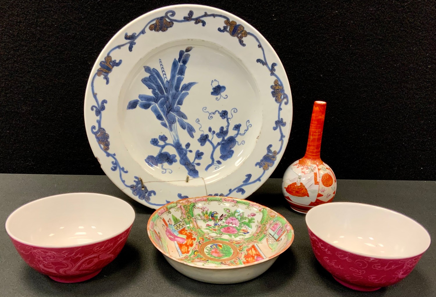 A Chinese export plate, decorated in underglaze blue, c.1770; a Cantonese saucer dish, c.1880; a