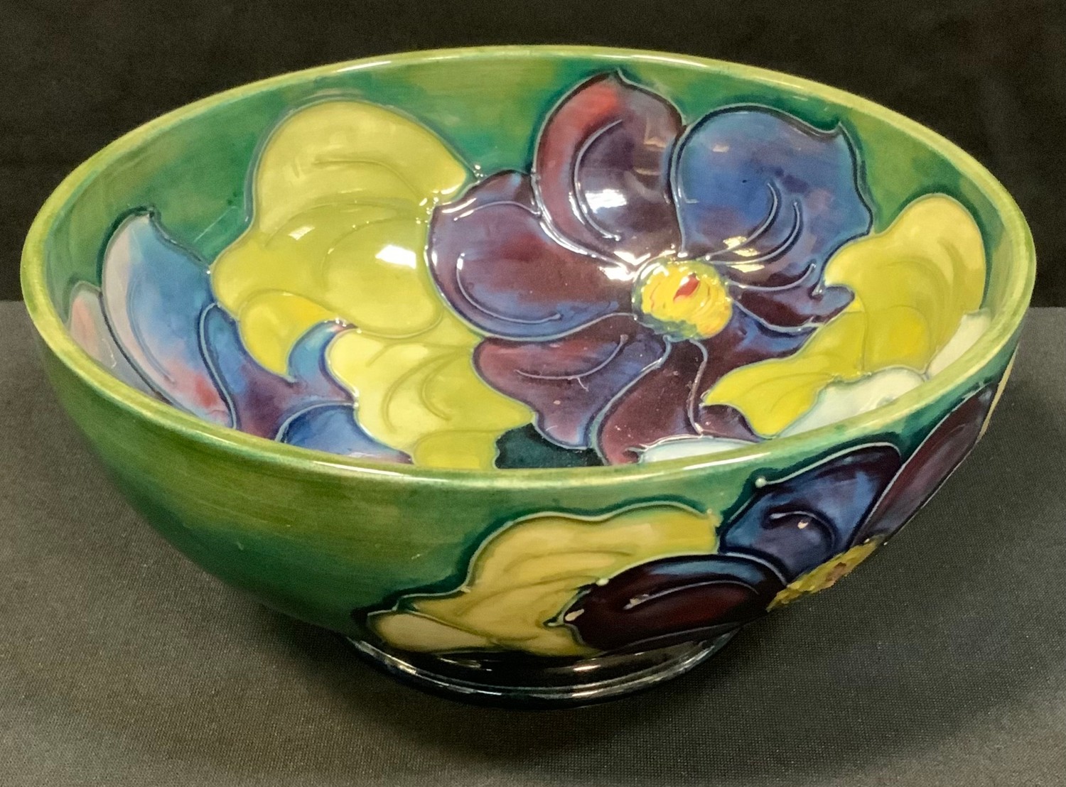 A Moorcroft Clematis pattern bowl, tube-lined with large flowerheads, 15.5cm diam, printed mark,