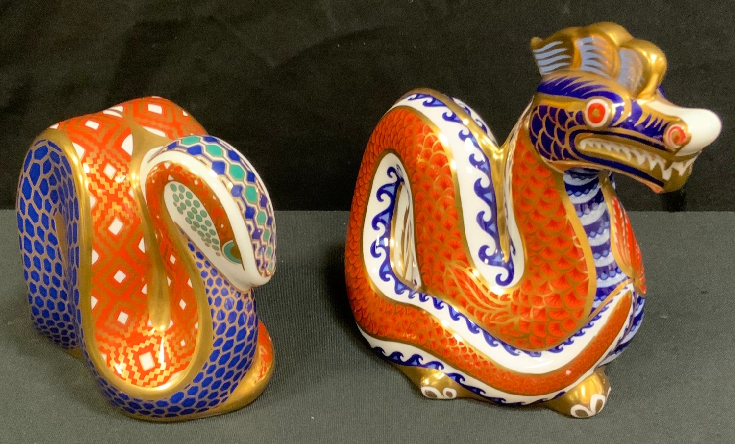 A Royal Crown Derby Dragon paperweight; another Serpent, both gold stopper (2)