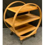 An Art Deco style bentwood three tier serving trolley, 89cm high, 70cm wide.