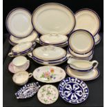 A Wedgwood & Co blue and gilt ten setting dinner service inc two tureens, oval meat plate, saucer