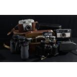 A pair of Wraystar 8 x 40 binoculars, cased; Omiya binoculars, cased; a Zeiss Ikon Contina camera;