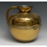 A large Middle-Eastern gilt brass ovoid ewer or your vessel, the waist applied with a rope twist