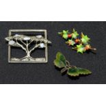 Brooches - an enamel butterfly, holy brooches, an Arts and Crafts tree brooch