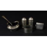 An Edwardian silver vesta case, Birmingham 1906; a pair of silver salt and pepper pots, marked