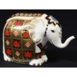 A Royal Crown Derby paperweight, Elephant, 1128 pattern, trunk raised, silver stopper