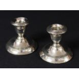 A George V pair of silver boudoir candlesticks, Birmingham 1922