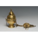 A 19th century brass ecclesiastical thurible censer, ogee cover pierced with Gothic tracery, 21cm