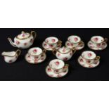 A Hammersley miniature tea set for six, teapot, sucrier and cover, milk jug, six cups and saucers,