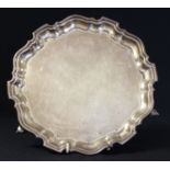 A silver shaped circular salver, in George III style, ball and claw feet, 20cm diam, Viners,