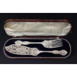 A pair of Victorian EPNS Rich Bead pattern fish servers, pierced and engraved with boats on a choppy