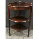 A George III mahogany wash stand converted to corner whatnot, shaped gallery, three tiers. 89cm high