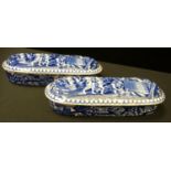 A pair of scarce early 19th century pearlware blue and white two section washing tooth brush holders