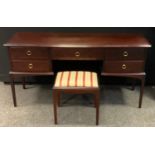 A Stag Furniture mahogany dressing table, fitted with five short drawers, 70cm high, 143cm wide,