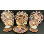 A set of three Royal Crown Derby 2451 Imari dinner plates, 27cm diameter, all seconds; an 1128