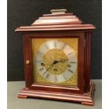 A contemporary German mahogany bracket clock, two tone dial, Roman numerals, eight day mechanical