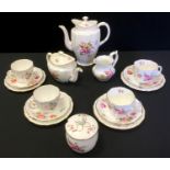 A Royal Crown Derby tea set for four comprising teapot, milk, teacups, saucers and tea plates; a