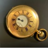 An 18ct gold half hunter cased pocket watch, White enamel dial, subsidiary seconds, button wind