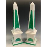 A pair of malachite green and light grey stone obelisks, 41cm high