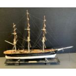 A wooden model The Cutty Sark, 39cm high, 52cm long