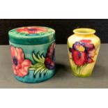 Moorcroft - an Anemone pattern cylindrical cachet pot, 9.5cm high, 8.5cm diameter; a small Orchid