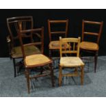 An Edwardian mahogany arm chair; a set of three side chairs, cane seat; pine chair.(5)