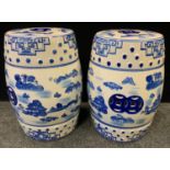 A pair of contemporary Chinese conservatory barrel seats, decorated in blue and white with