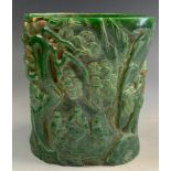 A large contemporary Chinese carved green stone effect brush pot, decorated with figural