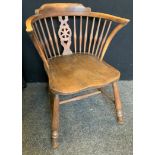 An early 20th century beech side chair, spindle back, H stretcher