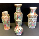 A 19th century Cantonese Famille rose vase decorated with opposing panels of figures and flowers,