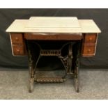 A Singer treadle sewing machine,