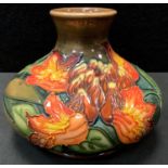 A Moorcroft Flames of the Forest pattern squat vase, designed by Philip Gibson, 1997, impressed