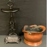 A Victorian cast iron stick stand, open cast back, curved rest and drip tray base, 63cm high, 27cm
