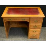 A 20th century oak desk, rectangular top with a leather writing surface, long drawer over