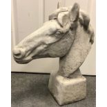 A reconstituted stone horses head, 60cm high