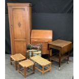 A 20th century oak hall robe, 178cm high, 65cm wide; a 20th century oak bureau, fall front above one