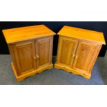 A pair modern pine side cabinets, two door front, 71cm high, 68cm wide, 40cm deep