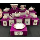 A Royal Doulton Franz pink rose pattern sugar bowl; others rose bowl, cream jugs, candle holders,