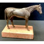 A 20th century silver coloured metal sculpture, Standing Horse, pink marble plinth, 10.5cm high,