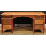 A large twin pedestal writing desk, rectangular top above an arrangement of slides and drawers,