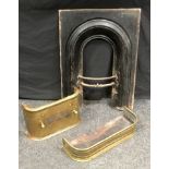 A Victorian cast iron bedroom fire surround; a pierced brass fender; another. (3)