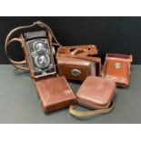 A Rolleiflex TLR 3.5B camera, produced 1954-1956, serial No 1491684, leather case, two filters,