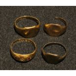 An 18ct gold ring, set with two ruby chips, 2.6g; a 9ct gold signet ring, a 9ct gold broken ring,