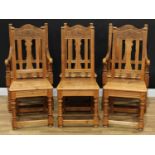 A set of six farmhouse kitchen chairs, comprising a pair of armchairs and four side chairs, the