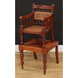 A late Victorian/Edwardian mahogany child's combination high chair and table, 89cm high overall, the