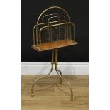 An oak and brass floor-standing sheet music or correspondence stand, triform base, ball feet, 74cm