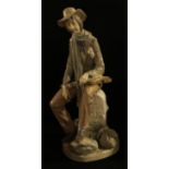 A Lladro porcelain figure, Travelling Violinist, 35cm high